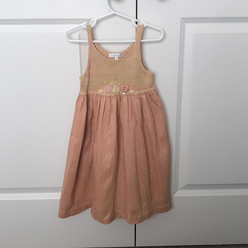 Boutique silk dress with floral appliqué.